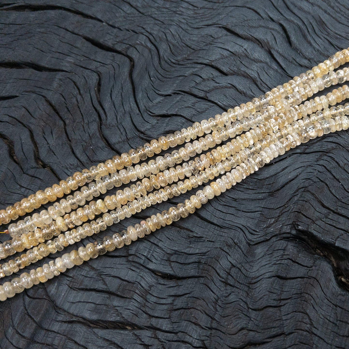 Rutilated Quartz 7x3mm Smooth Rondelle Bead - 8" Strand